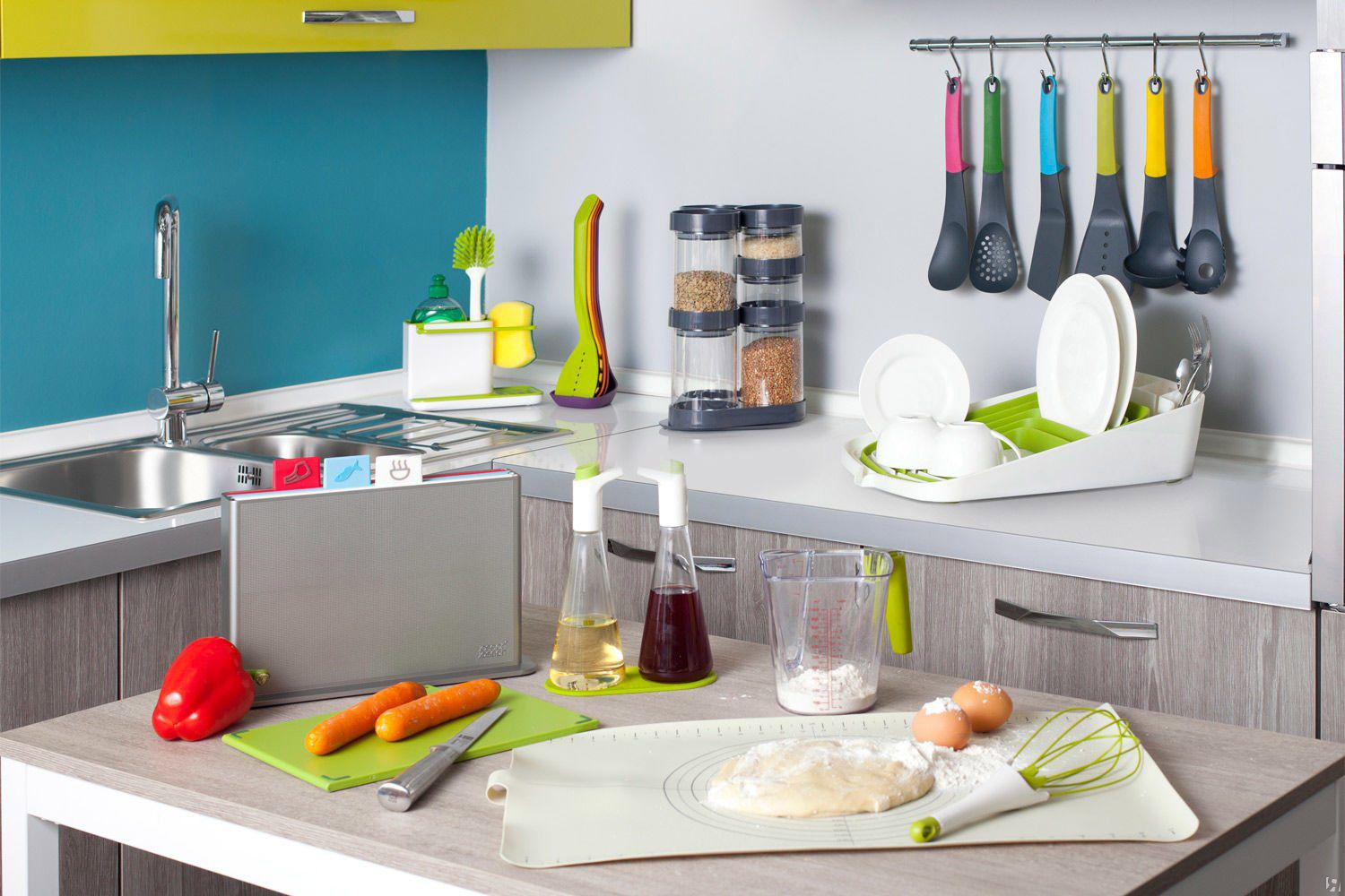 A variety of housewares supplies, including towels, mugs, and storage bins, arranged neatly in a home setting